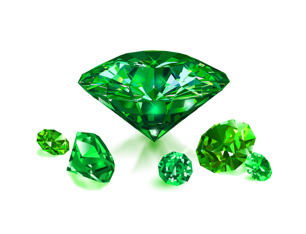 Beautiful green gems emeralds on white background