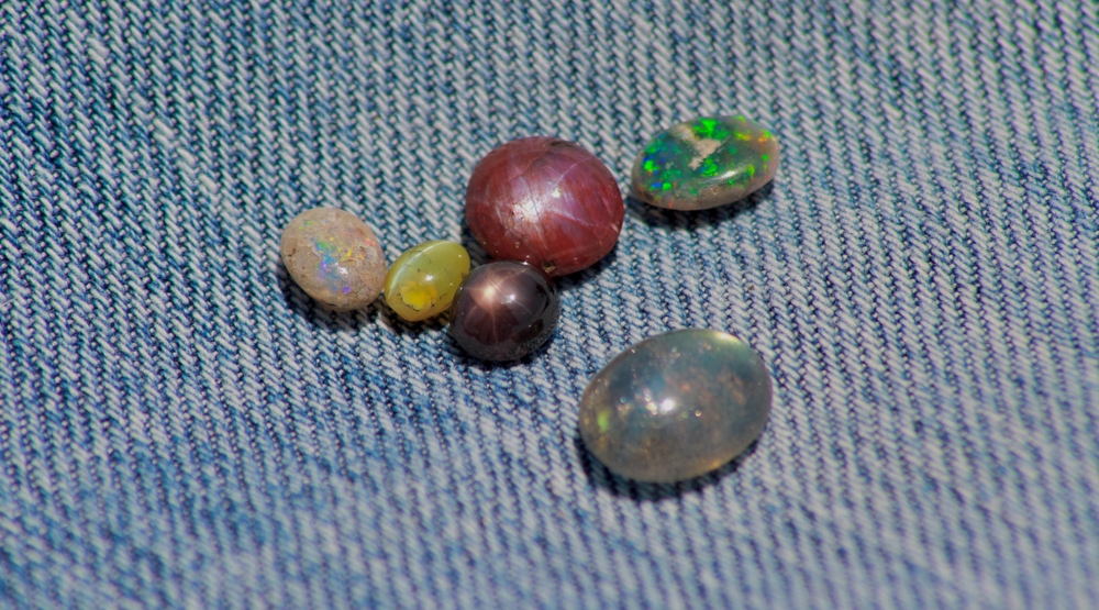 Closeup view of gemstones including star ruby star sapphire